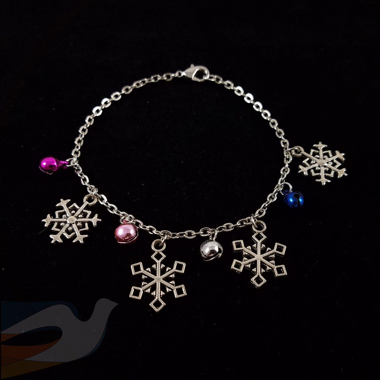 Snowflake and bell charm bracelet